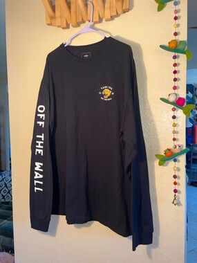 EUC Vans Growler long-sleeve t-shirt is a black cotton shirt featuring graphic